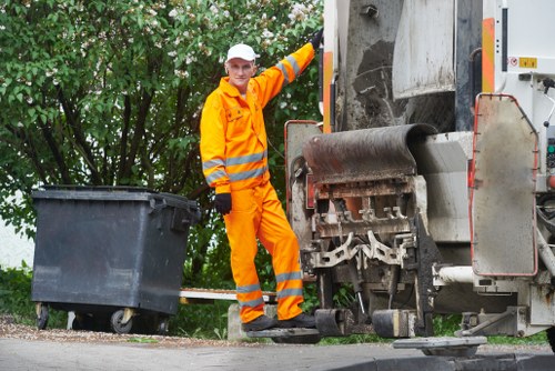 Segregated waste bags and labelled containers on site